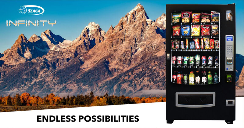 a vending machine with mountains in the background